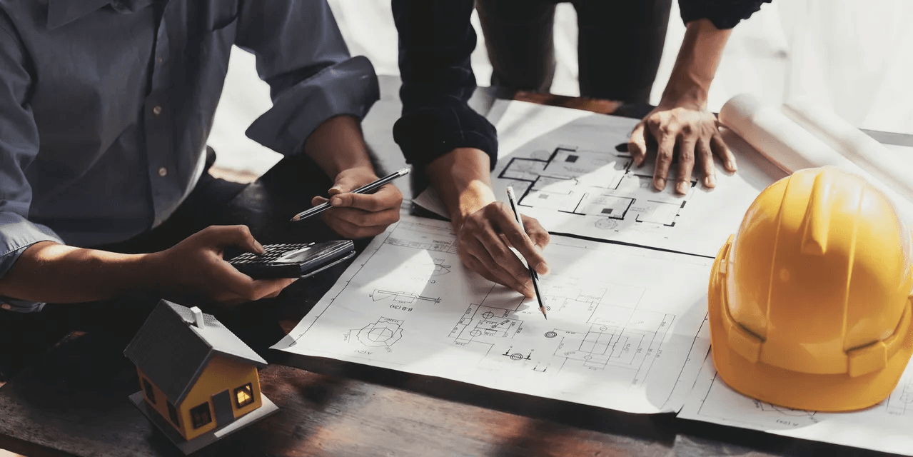 Workers planning the flooring of a home